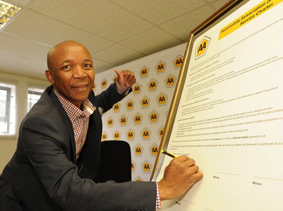 CEO Collins Khumalo signing the charter CEO Collins Khumalo signing the charter